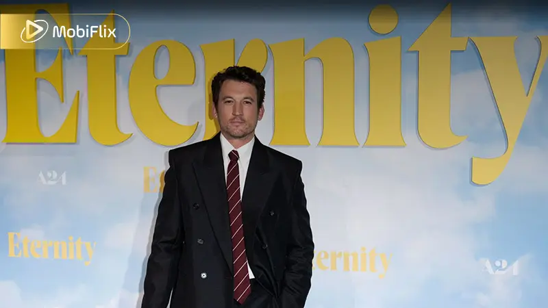 Miles Teller plays Larry Cutler, Joan’s husband in life, embodying the comfort, loyalty, and shared memories they built together